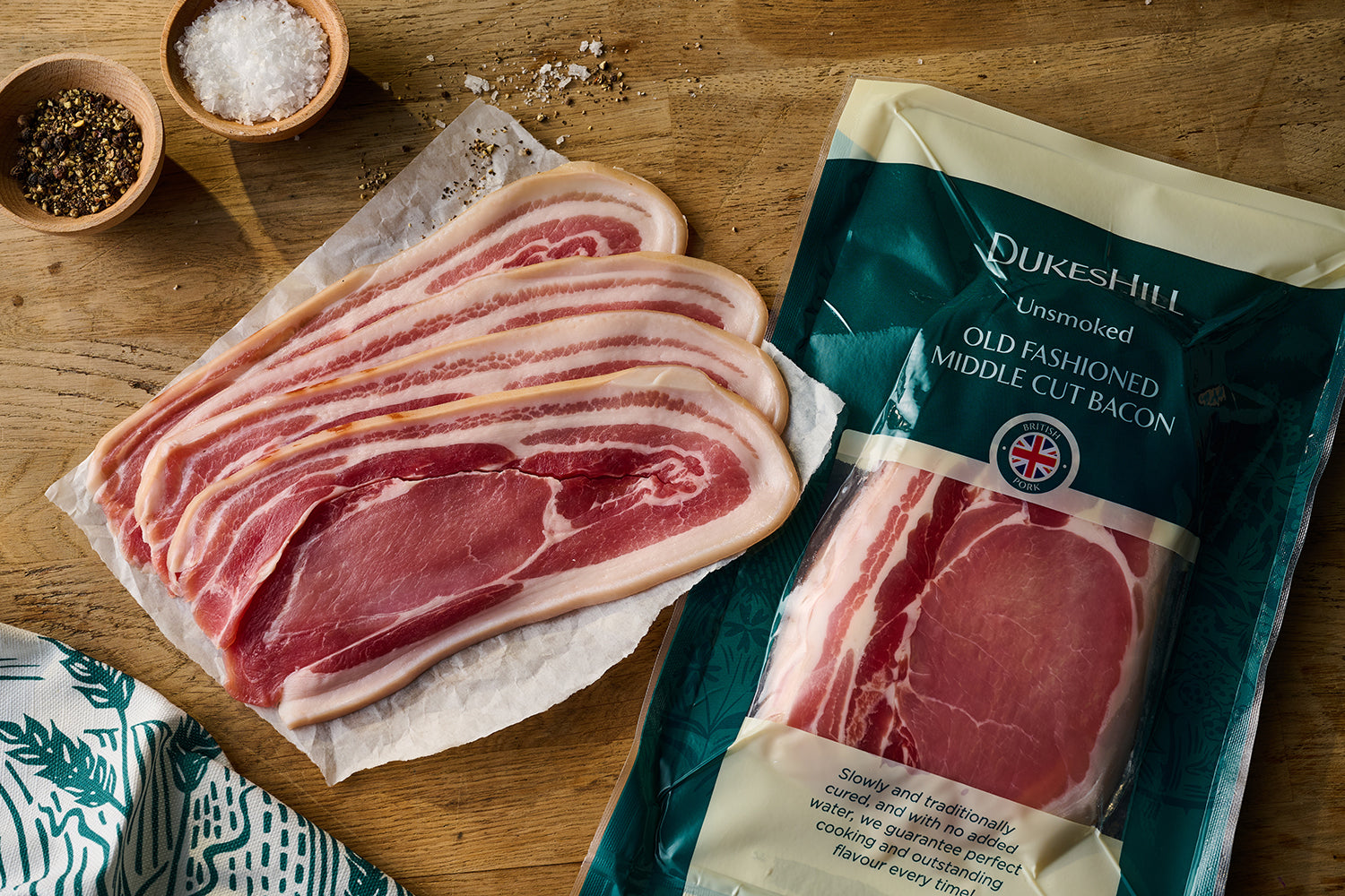 //www.dukeshill.co.uk/cdn/shop/files/Old_Fashioned_Middle_Cut_Bacon_Unsmoked_Raw_with_Packaging_01b.jpg?v=1708611934
