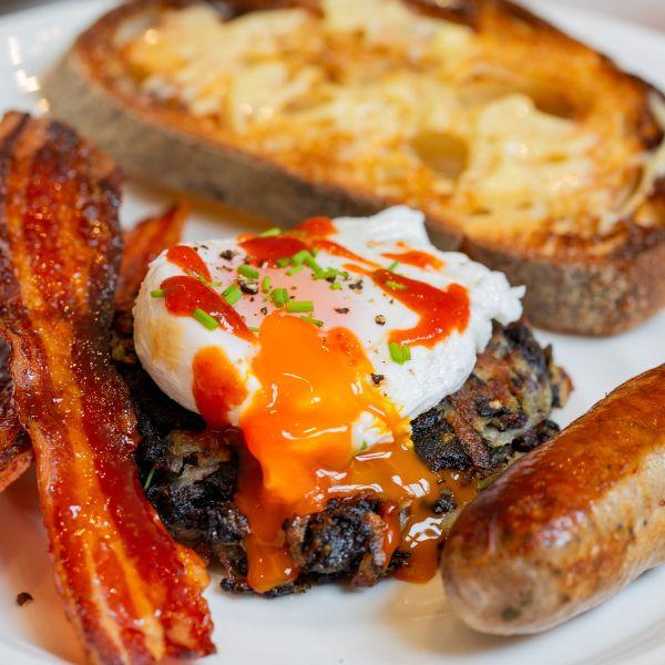 BLACK PUDDING ROSTI WITH POACHED EGG AND CRISPY SRIRACHA BACON - DukesHill