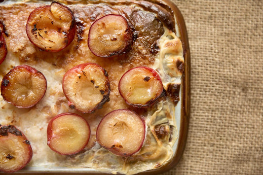 Baked Rice Pudding with Brown Sugared Plums On A Hessian Mat 