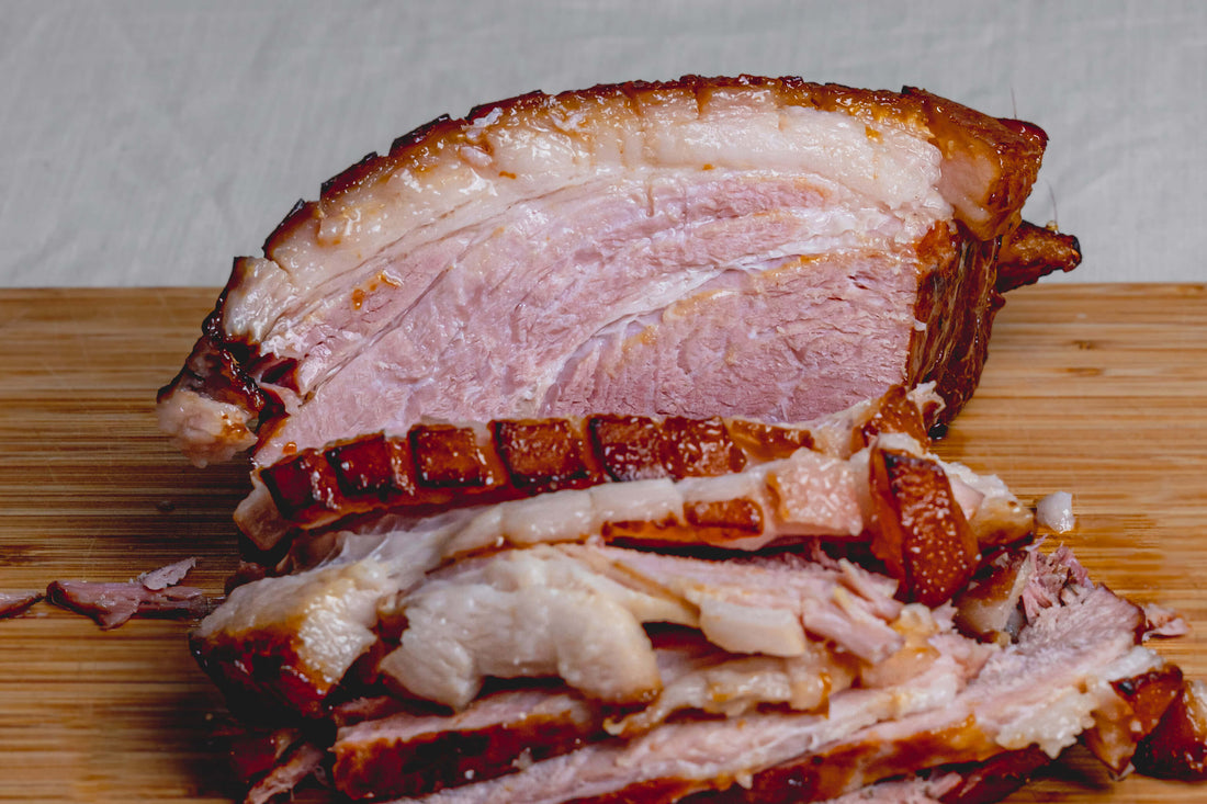 slow cooked ham on wooden board