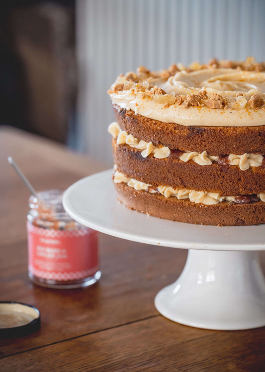 ginger and rhubarb cake on a cake stand