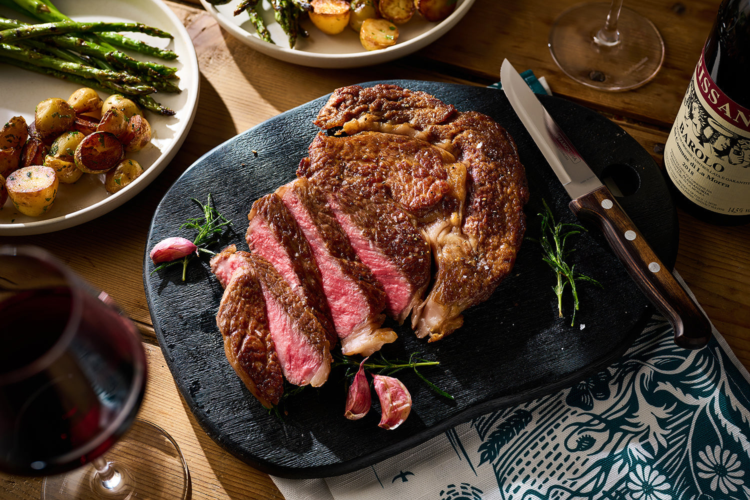 A Japanese A5 Wagyu Steak On A Slate Plate With 3 Strips Cut