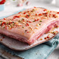 DukesHill Bone-In Pork Belly uncooked and seasoned on a plate 