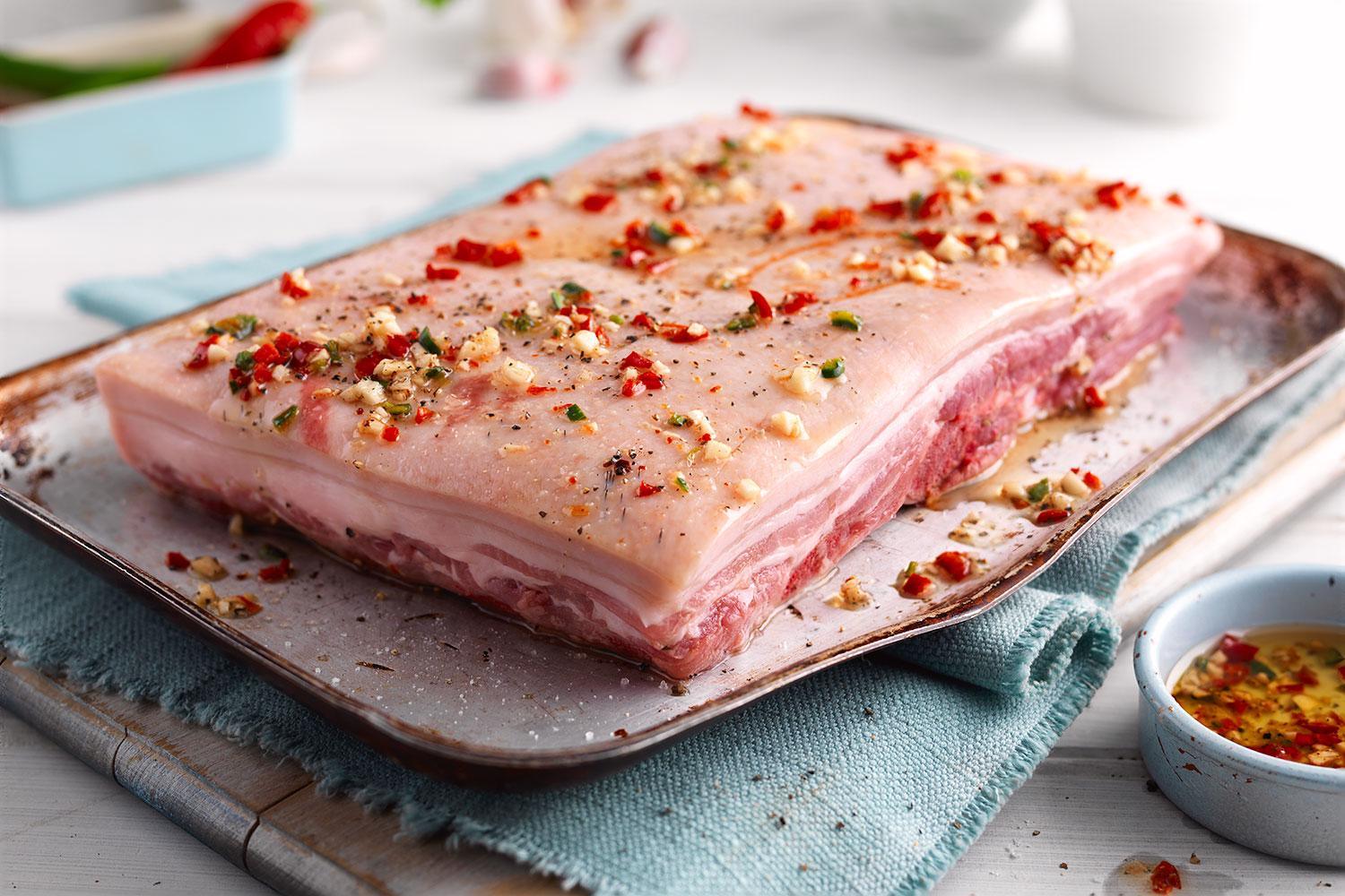 DukesHill Bone-In Pork Belly uncooked and seasoned on a plate 